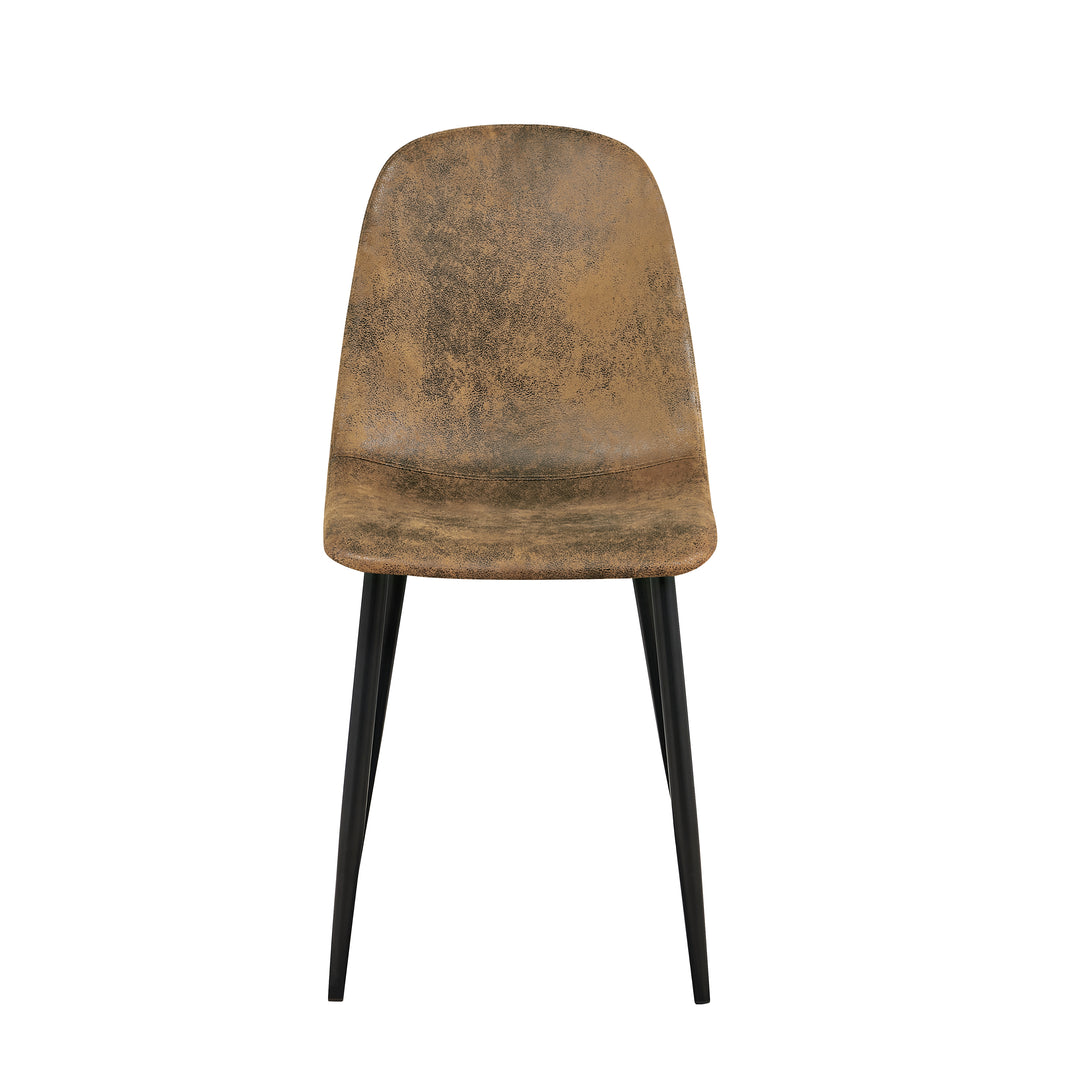 Set of four tan faux suede dining chairs with black metal legs. Curved shell supports the back and a slim frame saves space for kitchens, dining rooms, and apartments.